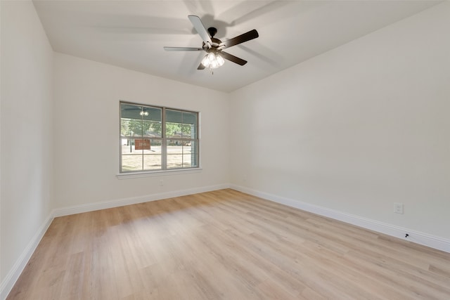 spare room featuring light hardwood / wood-style floors and ceiling fan