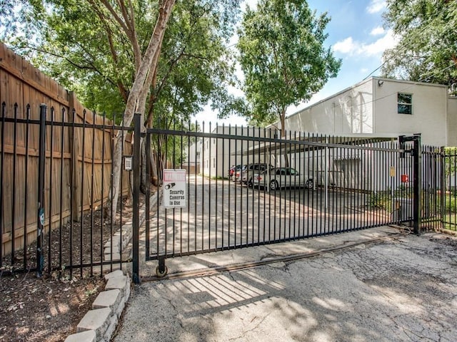 view of gate featuring fence