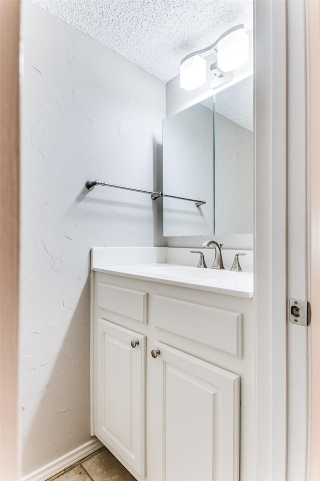 bathroom featuring vanity and a textured ceiling