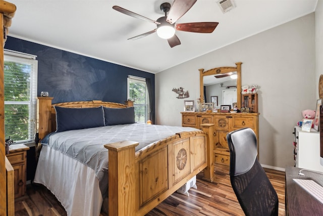 bedroom featuring hardwood / wood-style floors, ceiling fan, and lofted ceiling