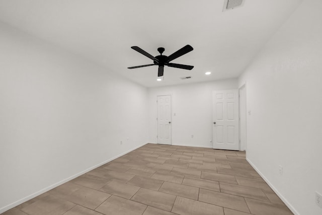 spare room with ceiling fan