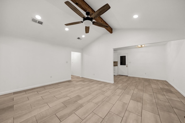 empty room with vaulted ceiling with beams and ceiling fan