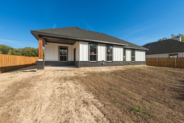 back of house with a patio area