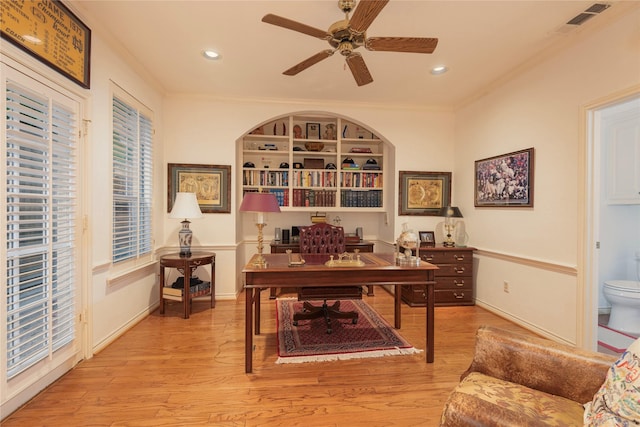 office space with ceiling fan, light wood-type flooring, and ornamental molding