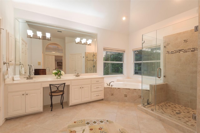 bathroom featuring vanity, tile patterned flooring, plus walk in shower, and lofted ceiling