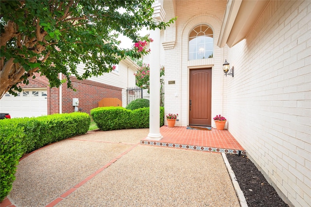 view of exterior entry with a garage