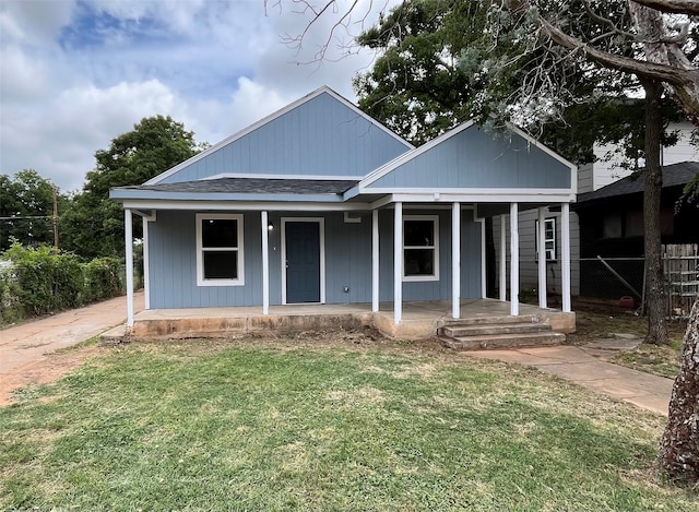 bungalow-style home featuring a front yard and a porch