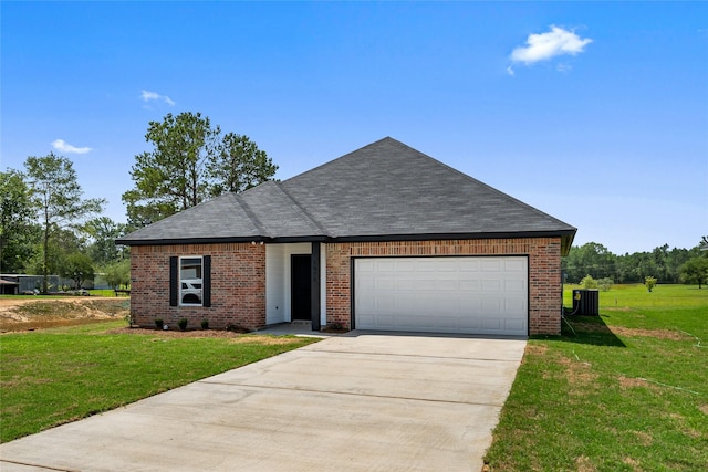 view of front of home featuring a garage and a front yard