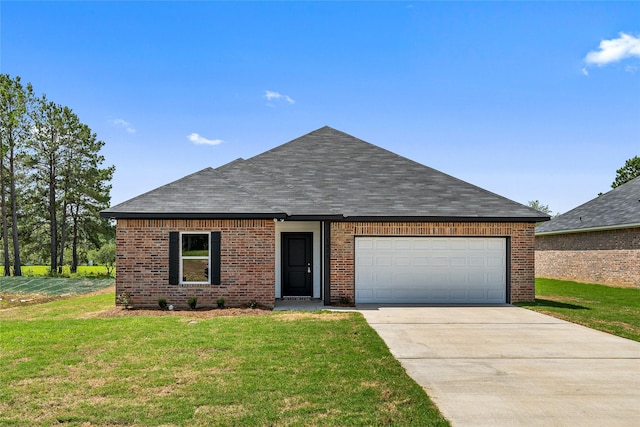 ranch-style home with a front yard and a garage