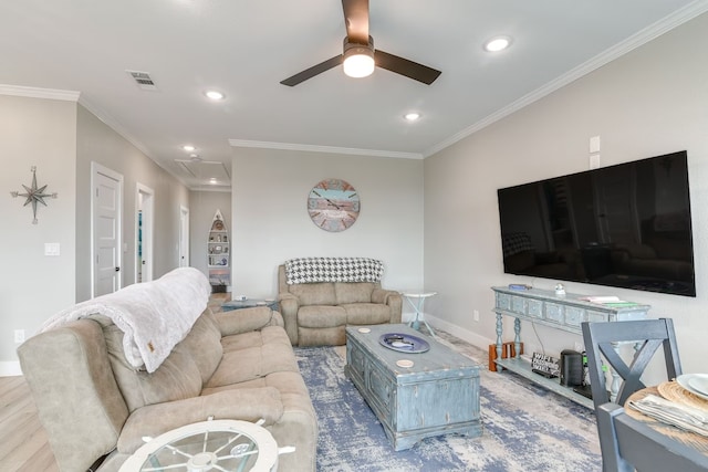 living room featuring ceiling fan, ornamental molding, and wood-type flooring