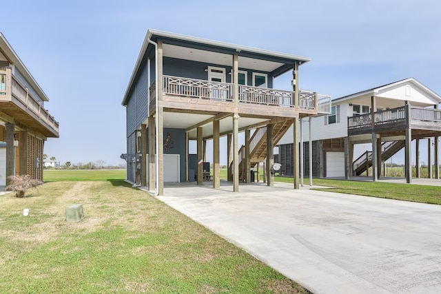 rear view of property with a carport, a yard, and covered porch