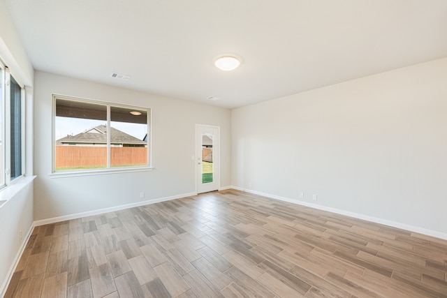 spare room with light hardwood / wood-style floors