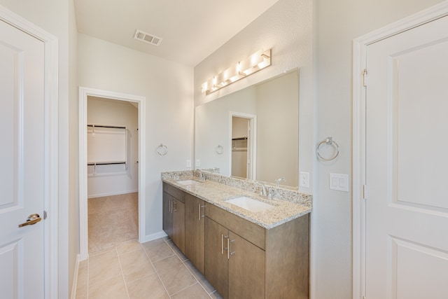 bathroom with vanity and tile patterned floors