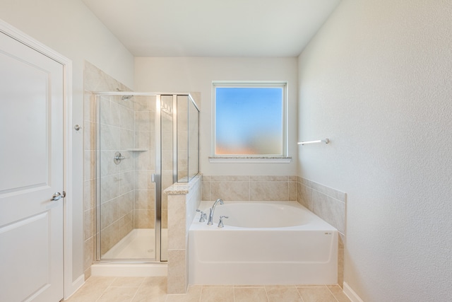 bathroom featuring independent shower and bath and tile patterned flooring