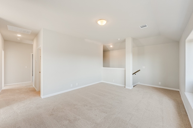 unfurnished room with light carpet