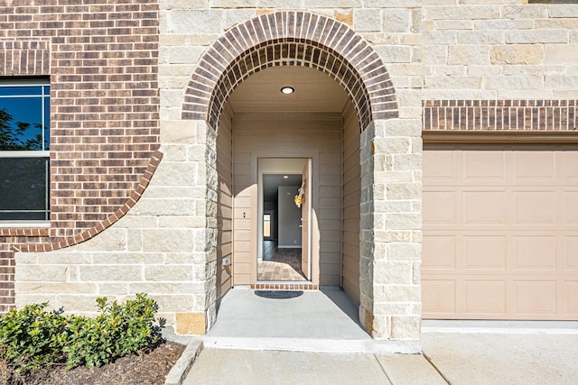 entrance to property featuring a garage