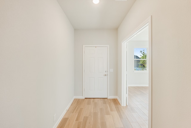 hall with light hardwood / wood-style floors