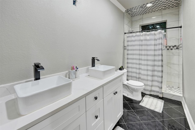 bathroom with a shower with shower curtain, vanity, toilet, and tile patterned floors