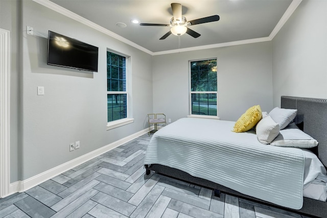 bedroom with multiple windows, ceiling fan, wood-type flooring, and ornamental molding