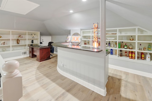 interior space featuring light hardwood / wood-style floors and lofted ceiling