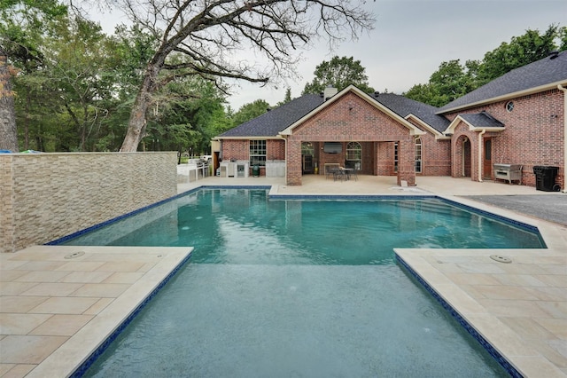 view of swimming pool with a patio area