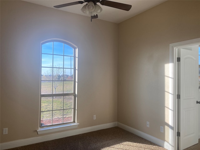 carpeted empty room with ceiling fan