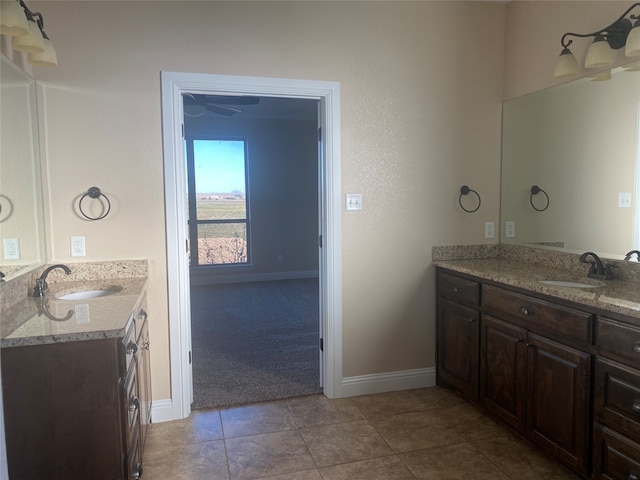 bathroom featuring tile floors and vanity