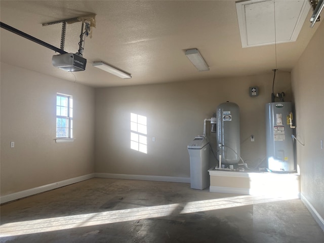 garage with a garage door opener and water heater