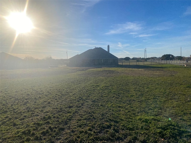 view of yard with a rural view