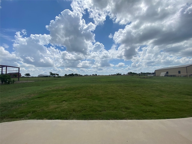 view of yard with a rural view