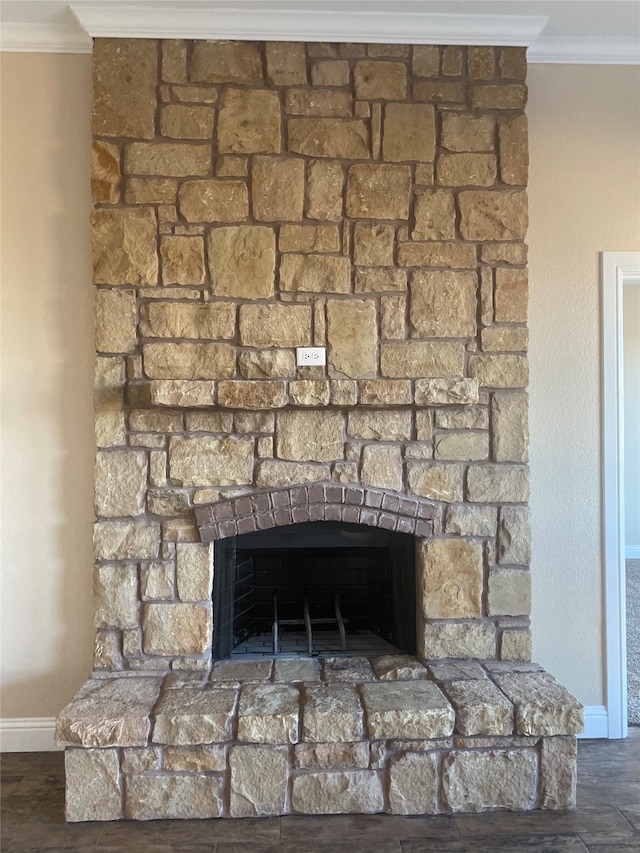 room details with ornamental molding, a fireplace, and hardwood / wood-style flooring