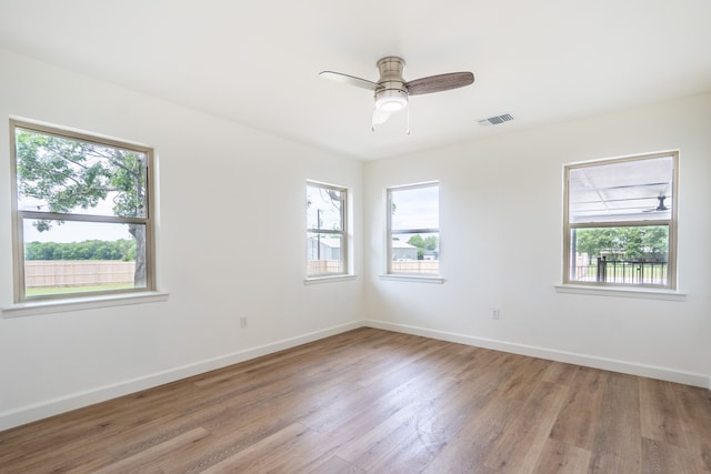 spare room with ceiling fan and light hardwood / wood-style flooring