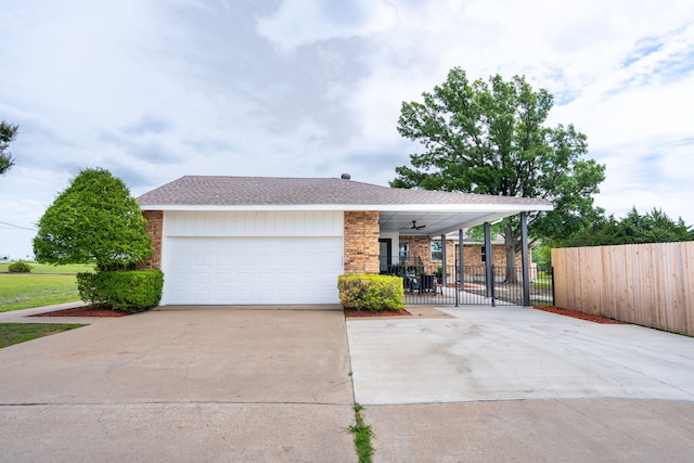 ranch-style house with ceiling fan and a garage