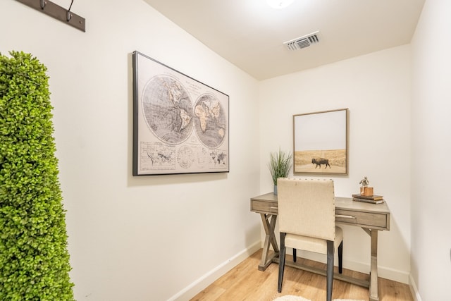 office with light hardwood / wood-style floors