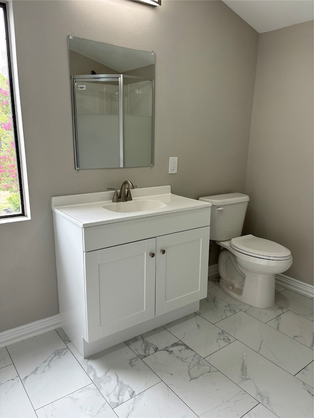 bathroom featuring tile flooring, vanity, and toilet