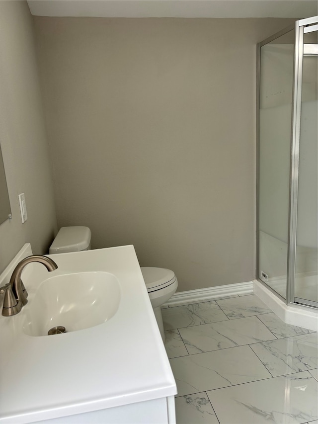 bathroom featuring a shower with shower door, tile flooring, vanity, and toilet