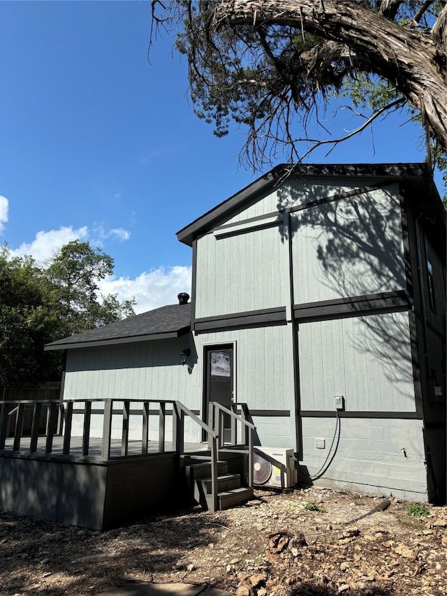 view of property exterior with a deck