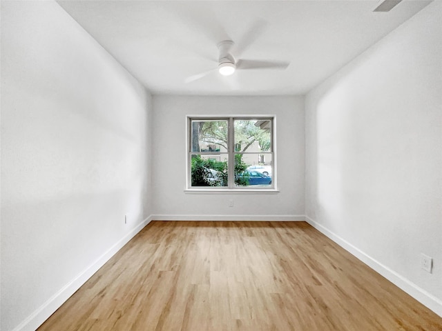 unfurnished room featuring light wood-type flooring and ceiling fan