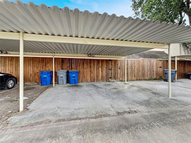 view of vehicle parking with a carport