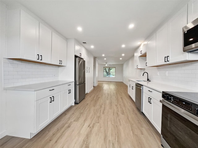 kitchen featuring white cabinets and stainless steel appliances