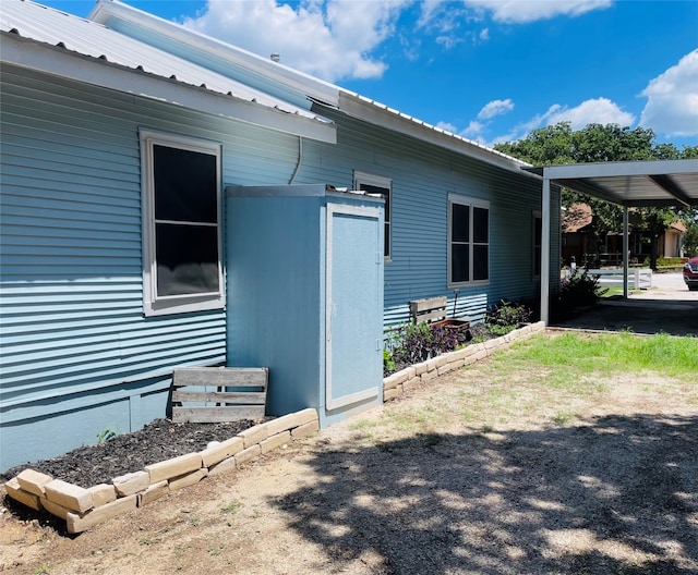 view of home's exterior featuring a carport