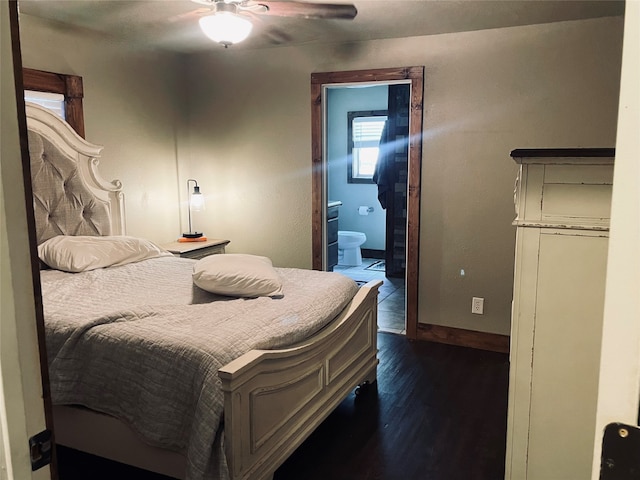 bedroom featuring dark wood-type flooring, a closet, ceiling fan, and connected bathroom