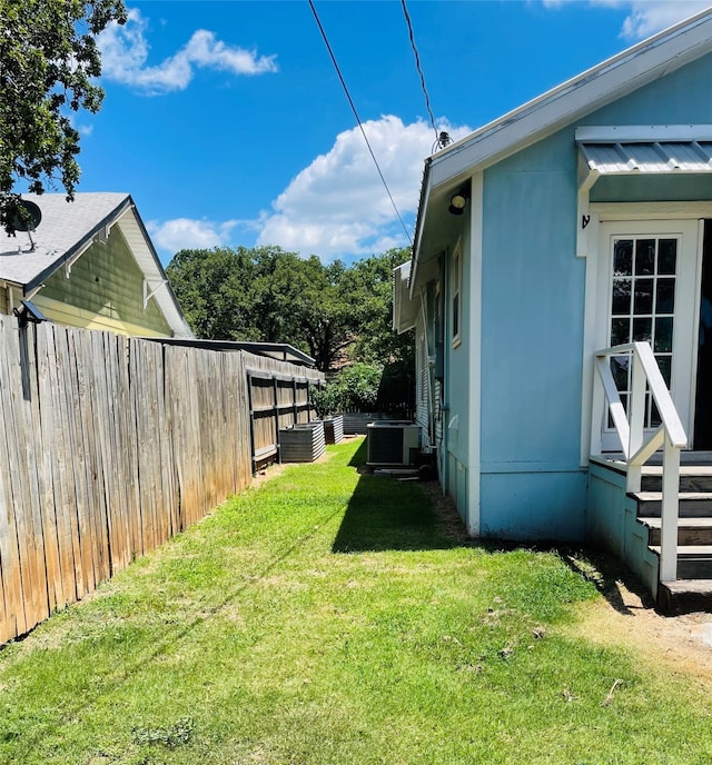 view of yard with central AC unit