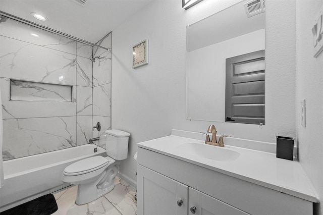 full bathroom featuring tiled shower / bath, vanity, and toilet