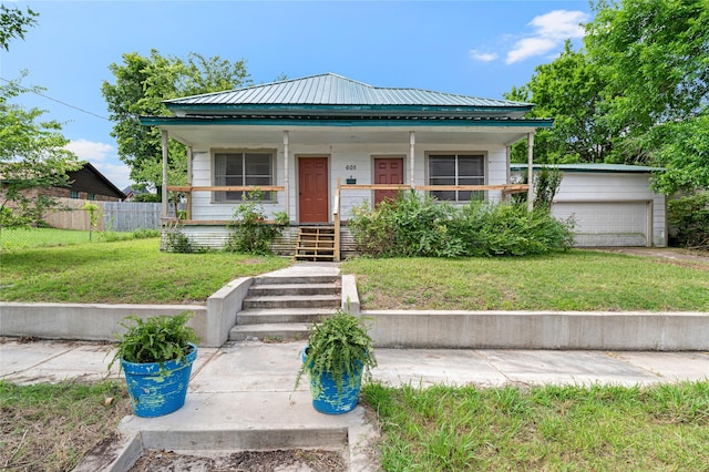 view of front of home with a front yard and a porch