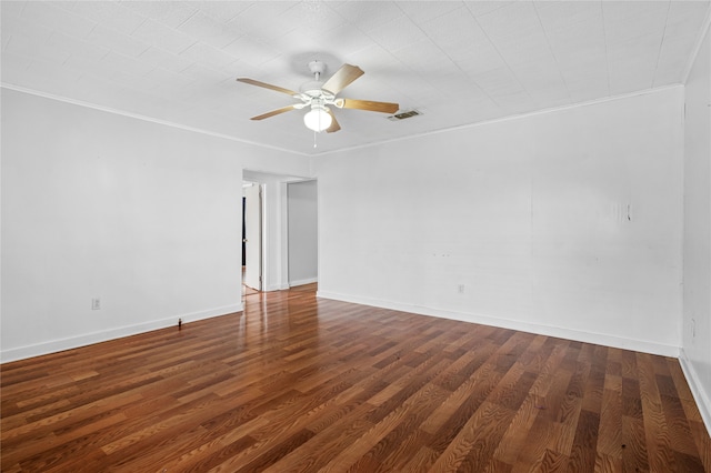 spare room featuring ceiling fan, dark hardwood / wood-style flooring, and ornamental molding