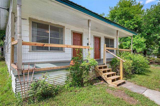 entrance to property with a porch