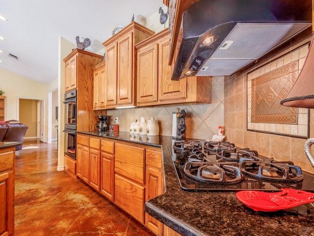 kitchen featuring double wall oven, black gas cooktop, tasteful backsplash, lofted ceiling, and range hood