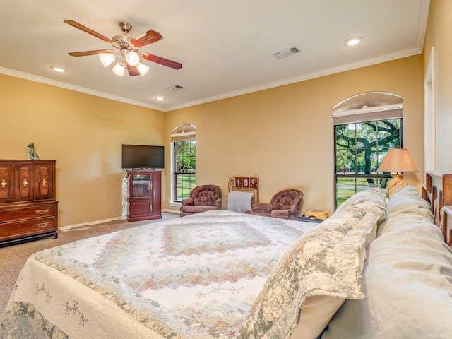 bedroom featuring ceiling fan, carpet flooring, and ornamental molding