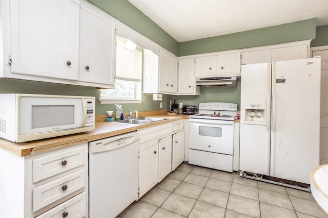 kitchen with sink, white cabinetry, white appliances, and light tile floors